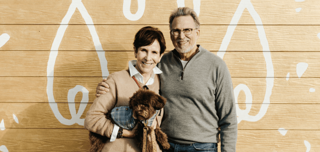 A couple holding their new Smeraglia puppy