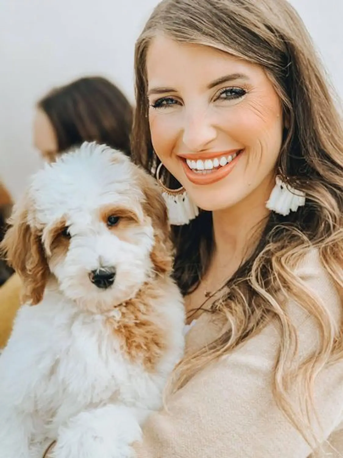 The F1BB Goldendoodle is being loyal to her owner by staying close by their side. This dog is a great companion and is always happy to be around people.