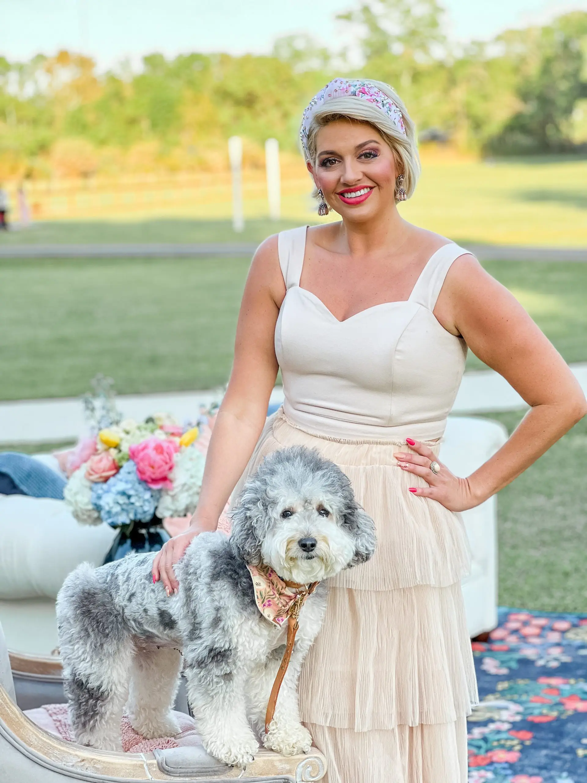 a small teddy bear schnoodle posing with a woman