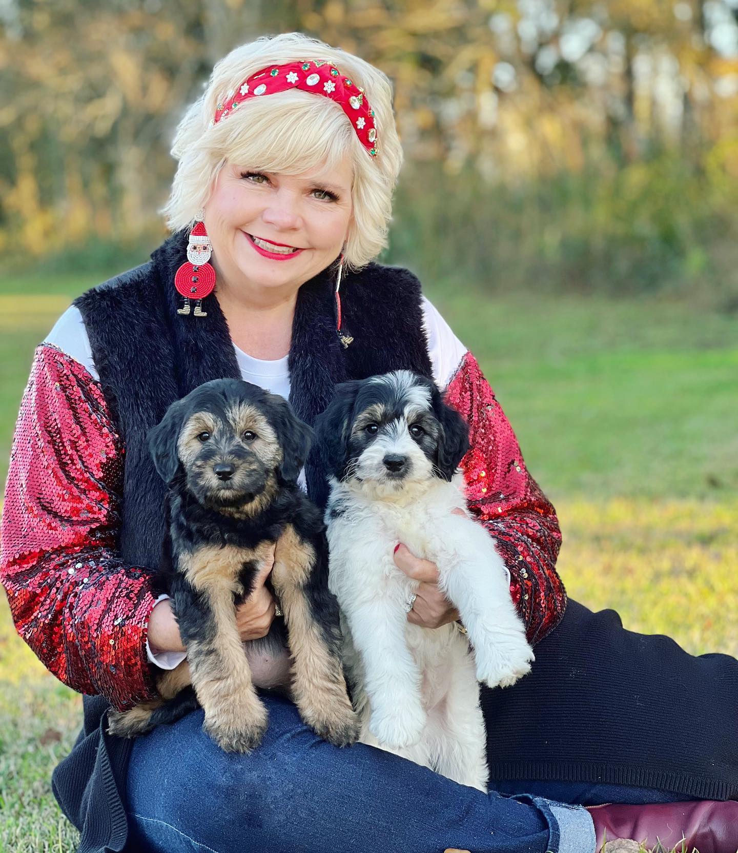Sherri Smeraglia holds a black and white parti golden doodle. This breed is known for its rare, beautiful black and white coloring. Goldendoodles also produce some of the most beautiful, rare markings and any other dog breed.